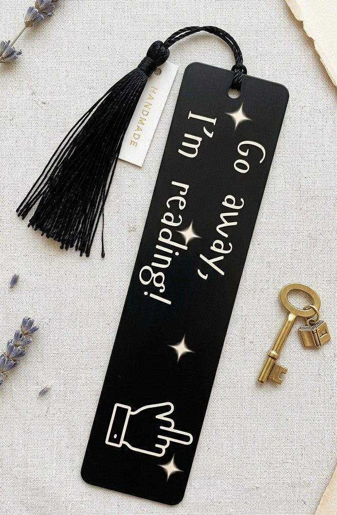 Go Away I'm Reading black PET plastic bookmark with bold white lettering and celestial star accents